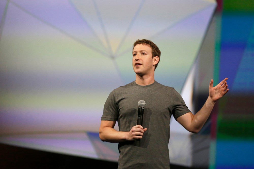 Facebook CEO Mark Zuckerberg gestures while delivering the keynote address at the f8 Facebook Developer Conference, April 30, 2014, in San Francisco, Calif.