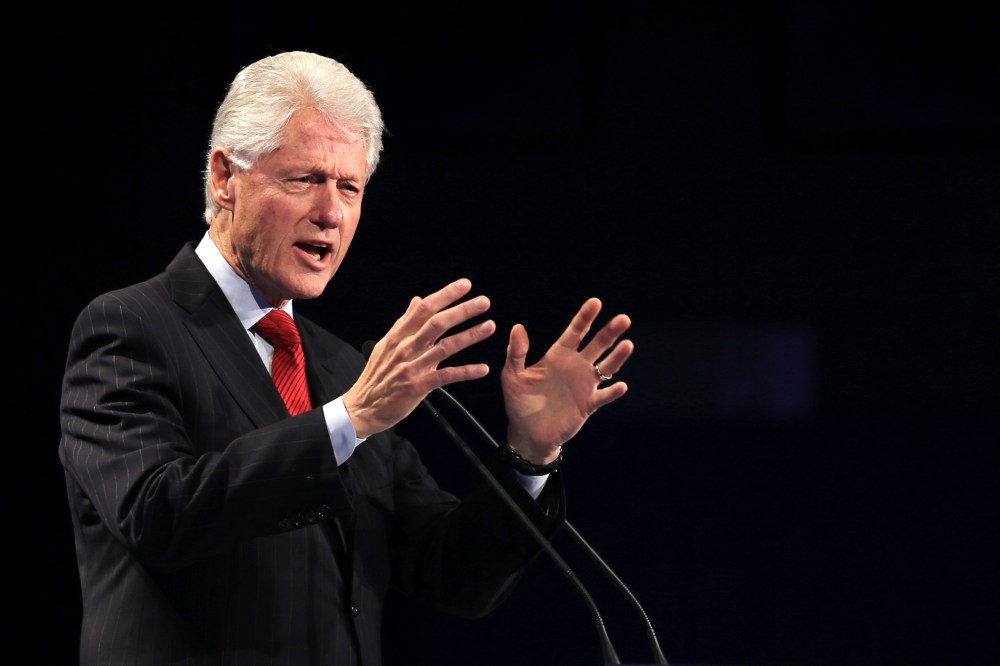 Former President of the United States Bill Clinton talks to the audience during the Global Teacher Prize ceremony in Dubai, United Arab Emirates, March 15, 2015. (Photo by Kamran Jebreili/AP)