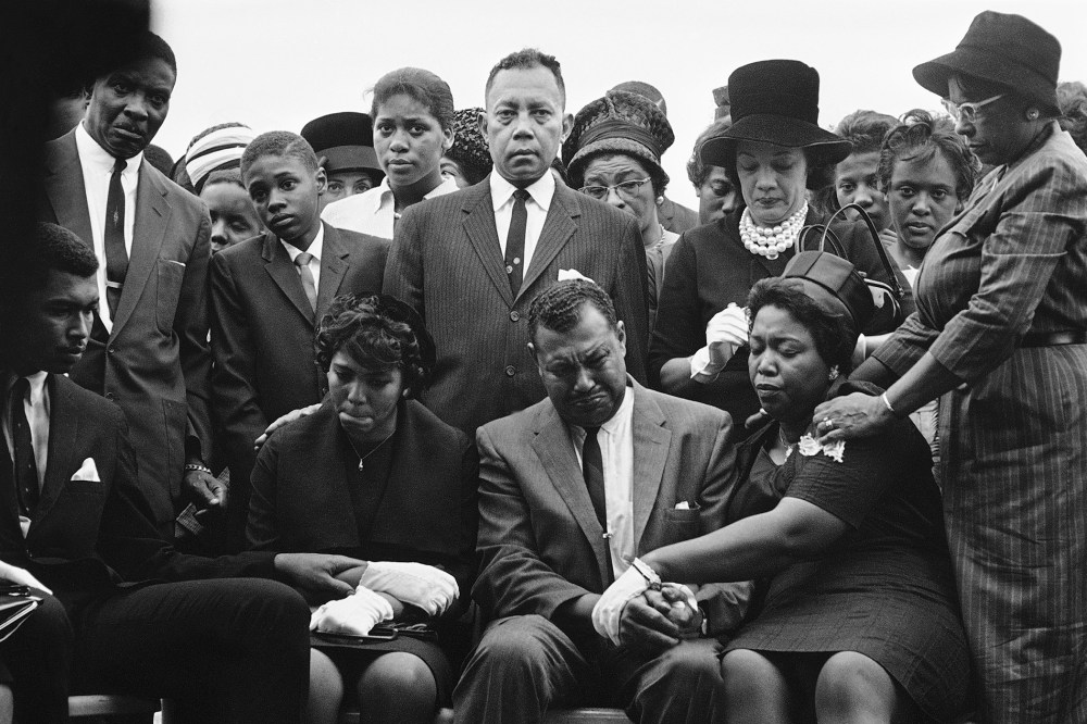 The family of Carole Robertson, a 14-year-old African American girl killed in a church bombing, attend graveside services for her, Sept. 17, 1963, Birmingham, Ala. (Photo by Horace Cort/AP)