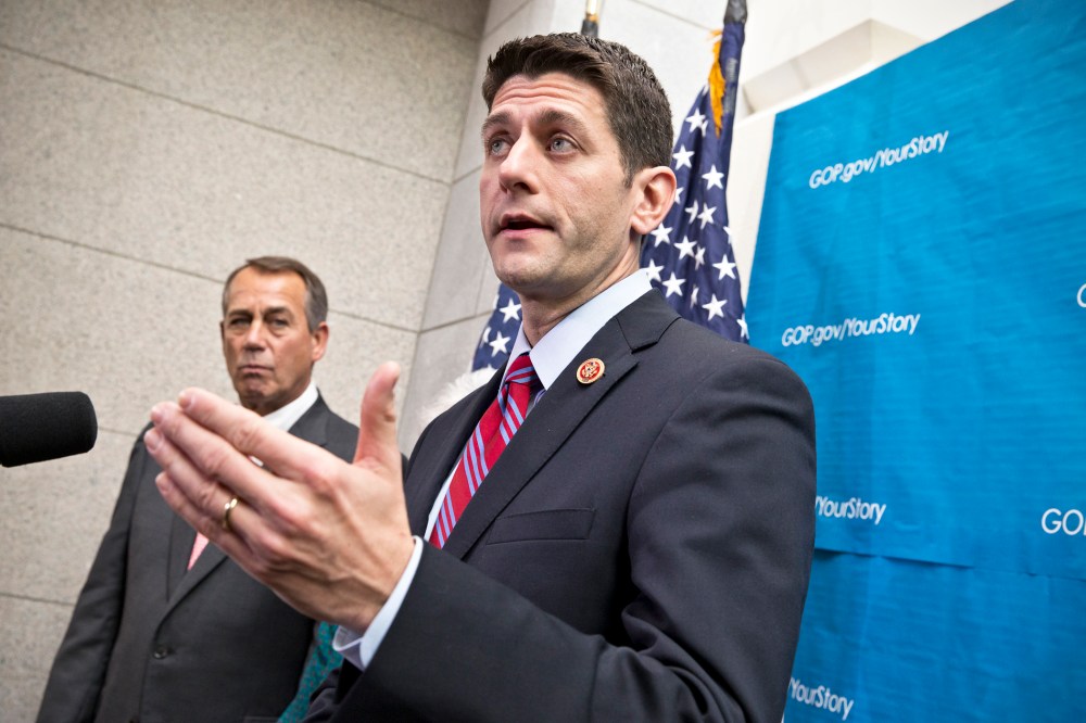 Paul Ryan takes reporters' questions as during a news conference on Capitol Hill, Dec. 11, 2013.