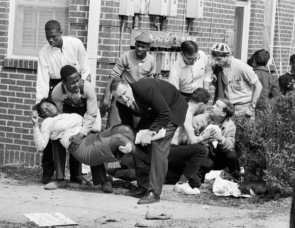 Mrs. S.W. Boynton is aided by two men after she was injured when state police broke up a demonstration march in Selma, Ala. on Bloody Sunday, March 7, 1965.