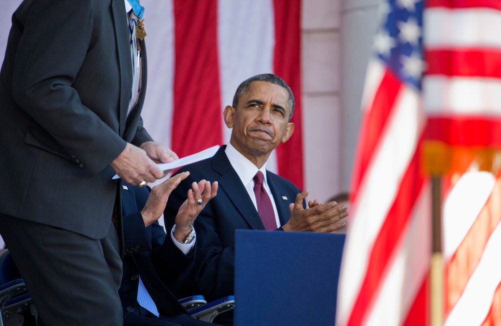 President Barack Obama applauds as Harold Fritz, president of the Congressional Honor Society