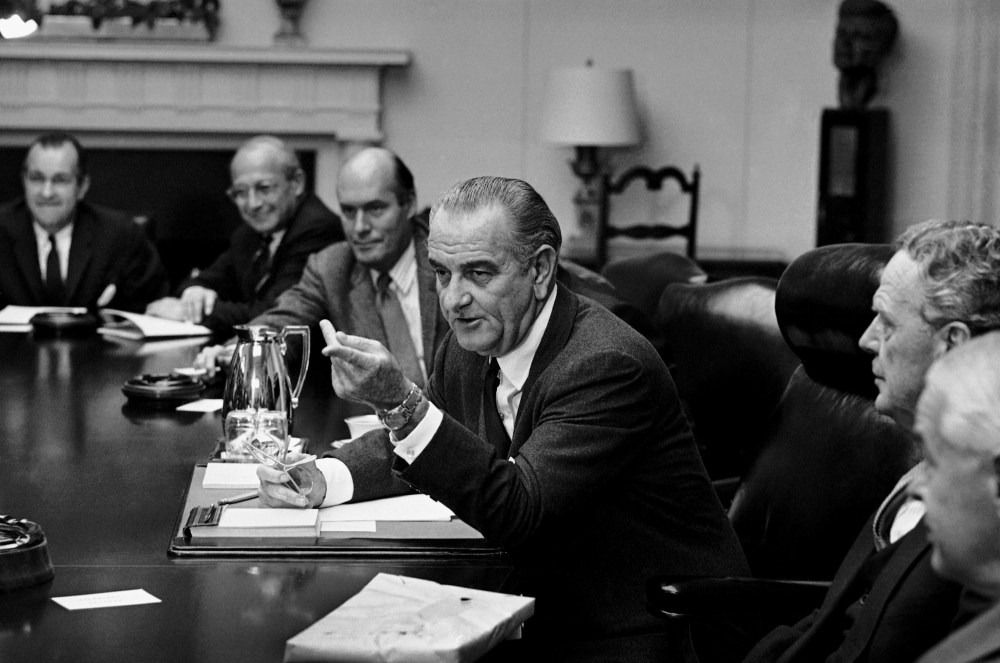 President Lyndon Johnson meets in the White House Cabinet Room with top military and defense advisers on Oct. 31, 1968 in Washington.