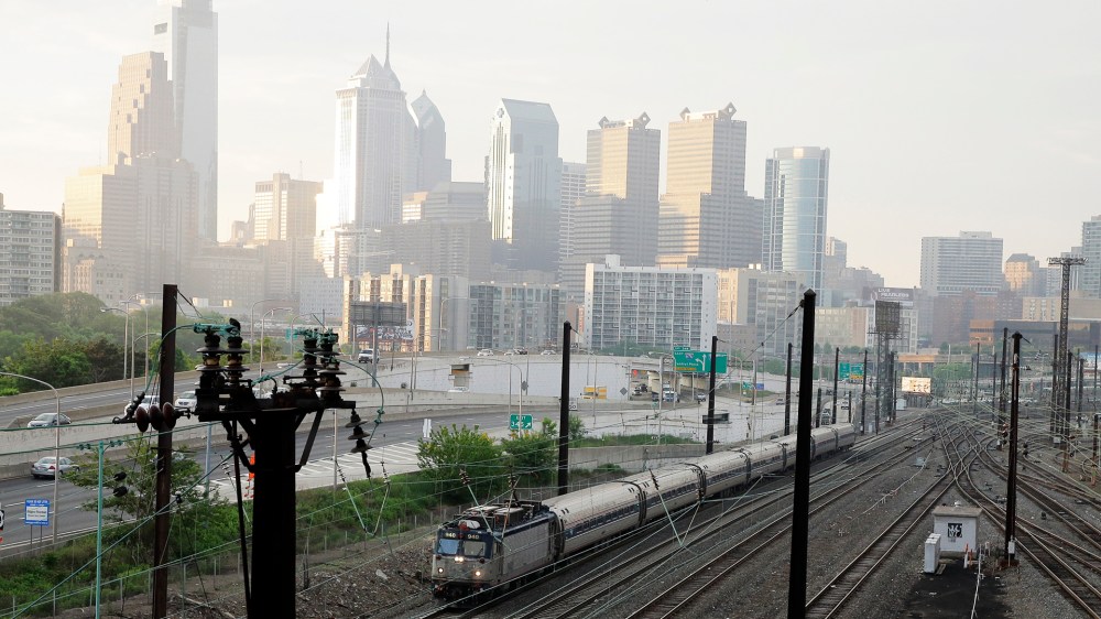 An Amtrak train travels northbound from 30th Street Station, May 18, 2015 in Philadelphia. (Photo by Matt Slocum/AP)