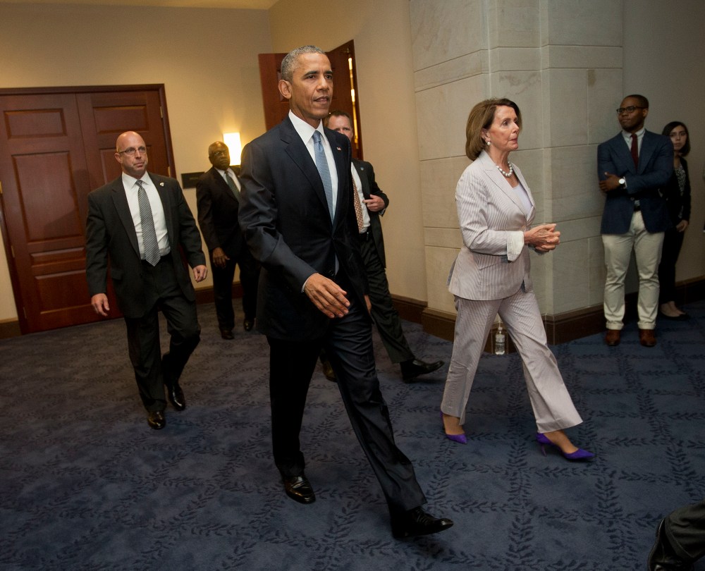 President Barack Obama and House Minority Leader Nancy Pelosi of Calif. leave meeting with House Democrats on Capitol Hill in Washington, June 12, 2015. (Photo by Pablo Martinez Monsivais/AP)