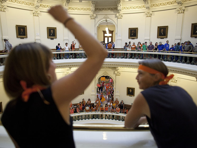 Hallie Boas and Lisa Fithian lead abortion rights chants from the third floor of the Texas Capitol Rotunda in Austin, Texas on Friday, July 12, 2013.  (Photo by Tamir Kalifa/AP)