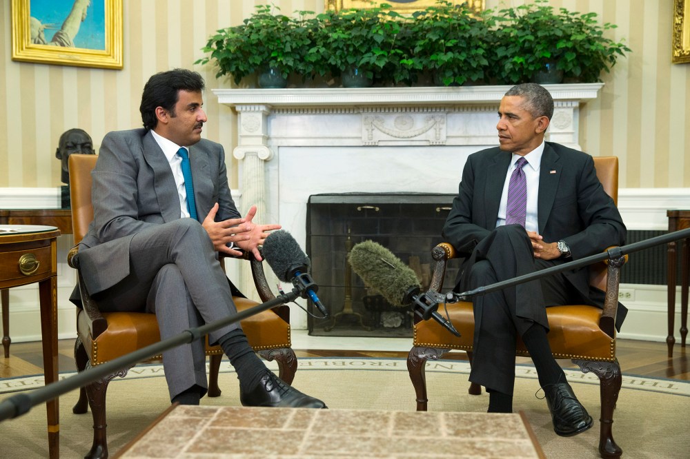 President Barack Obama meets with the Emir of Qatar Sheikh Tamim bin Hamad al Thani, on Feb. 24, 2015, in the Oval Office of the White House in Washington. (Photo by Evan Vucci/AP)