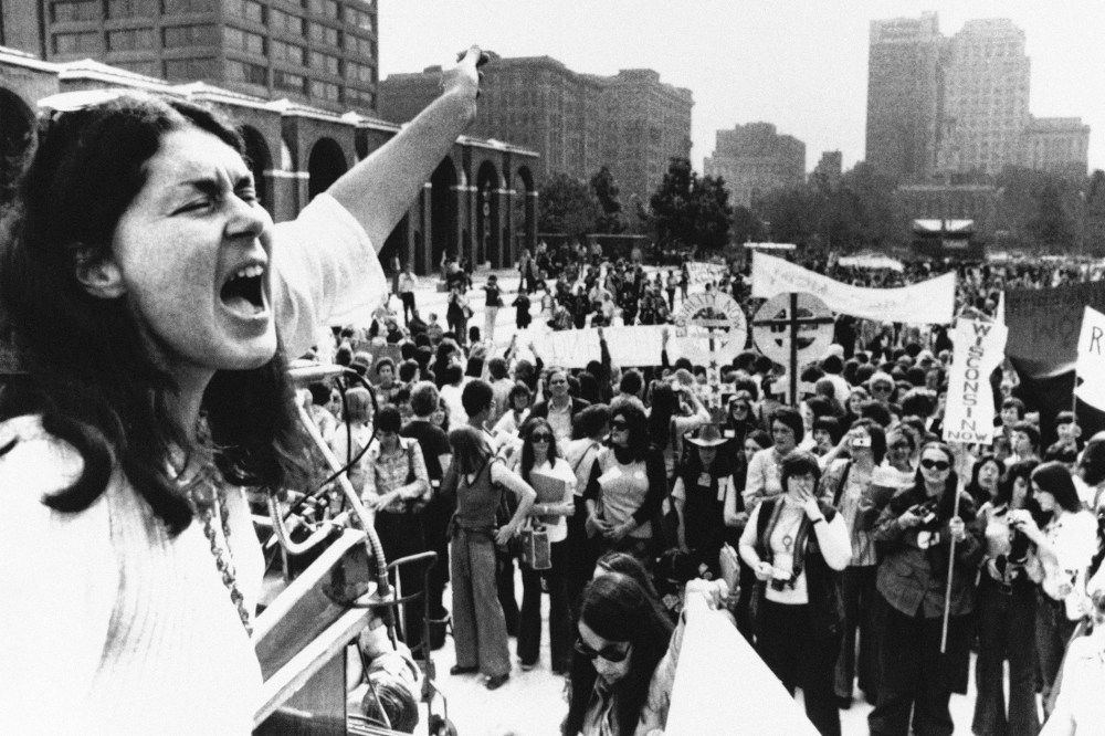 Karen DeCrow, president of the National Organization for Women, shouts to a crowd during a NOW parade held in Philadelphia, Oct. 25, 1975.