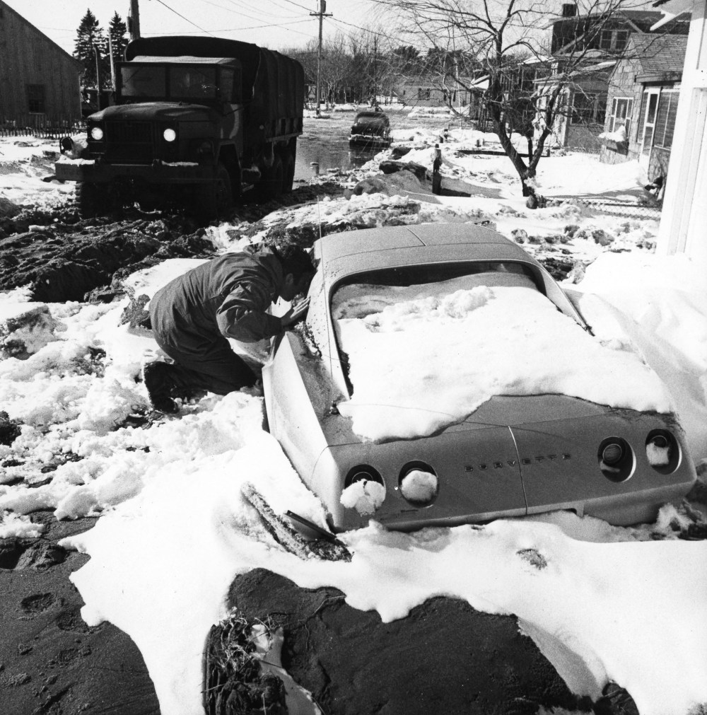 ** FILE ** ADVANCE FOR SUNDAY FEB. 2 ** A National Guardsman checks a stranded car Feb. 9, 1978, in Hampton, N.H., after the Blizzard of '78 to see if anyone was trapped inside. A winter storm combined with high tides flooded the New Hampshire seacoast...