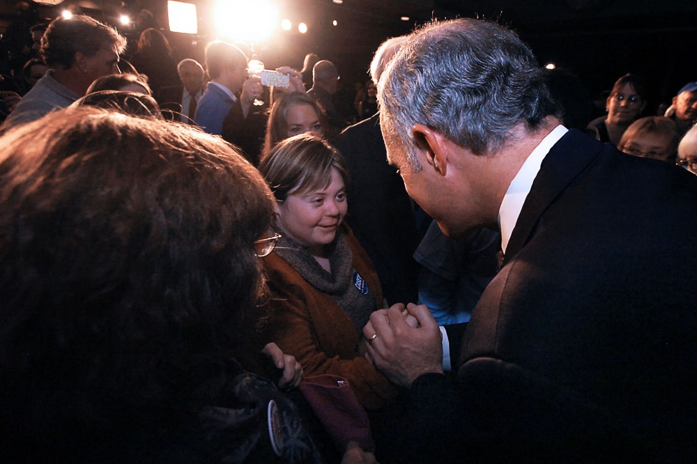U.S. Sen. Bob Casey, right, greets Sara Wolff in downtown Scranton, Pa.