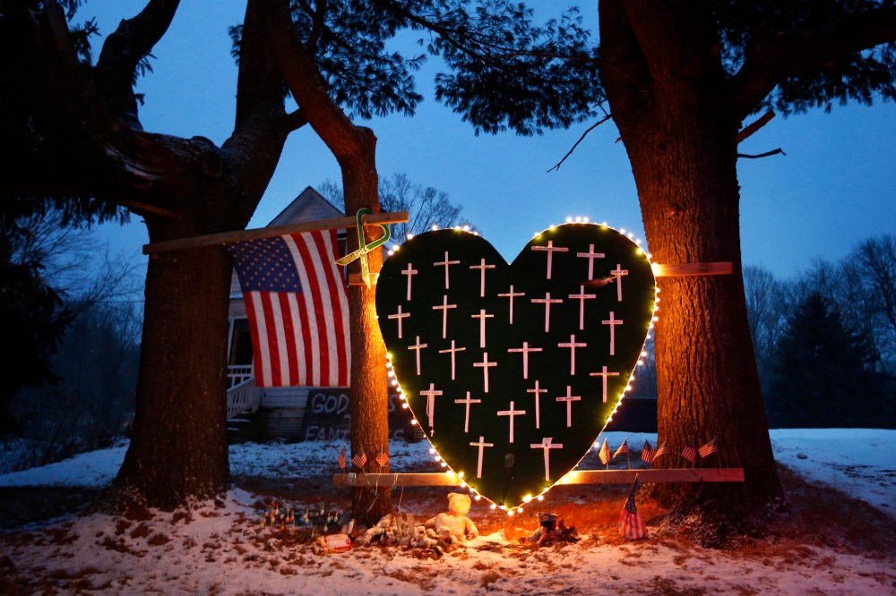 A makeshift memorial with crosses for the victims of the Sandy Hook Elementary School shooting massacre stands outside a home in Newtown, Conn. on Dec. 14, 2013. (Robert F. Bukaty/AP)