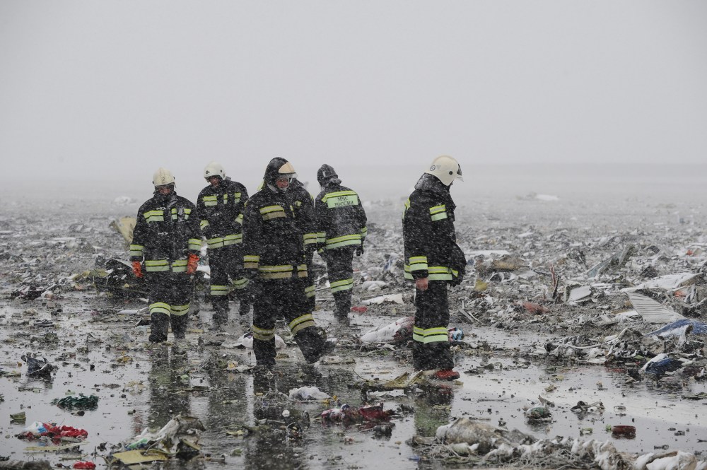 Russian Emergency Ministry employees are seen among the wreckage of a crashed plane at the Rostov-on-Don airport, about 950 kilometers (600 miles) south of Moscow, Russia, March 19, 2016. (Photo by STR/AP)