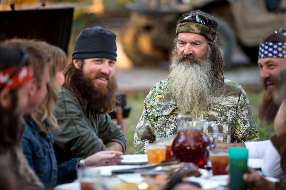 In an image released by A&E, Phil Robertson is flanked by his sons Jase Robertson, left, and Willie Robertson from the popular series "Duck Dynasty."