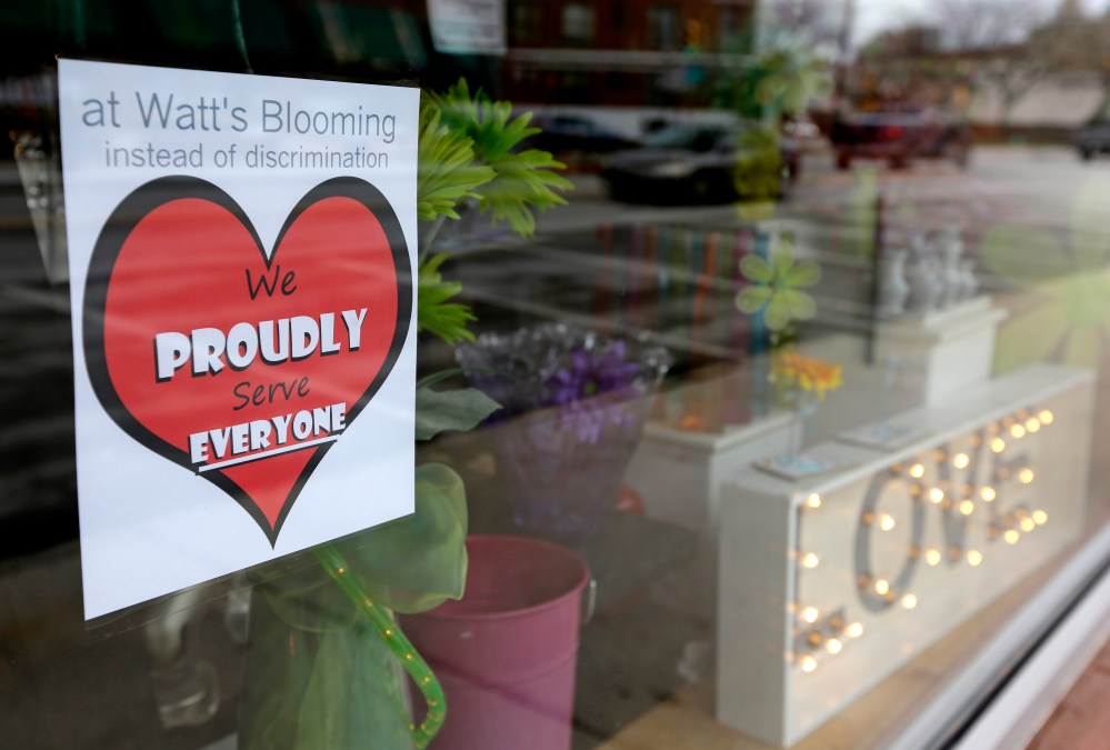 A window sign on a downtown Indianapolis florist, March 25, 2015, shows it's objection to the Religious Freedom bill passed by the Indiana legislature. (Photo by Michael Conroy/AP)