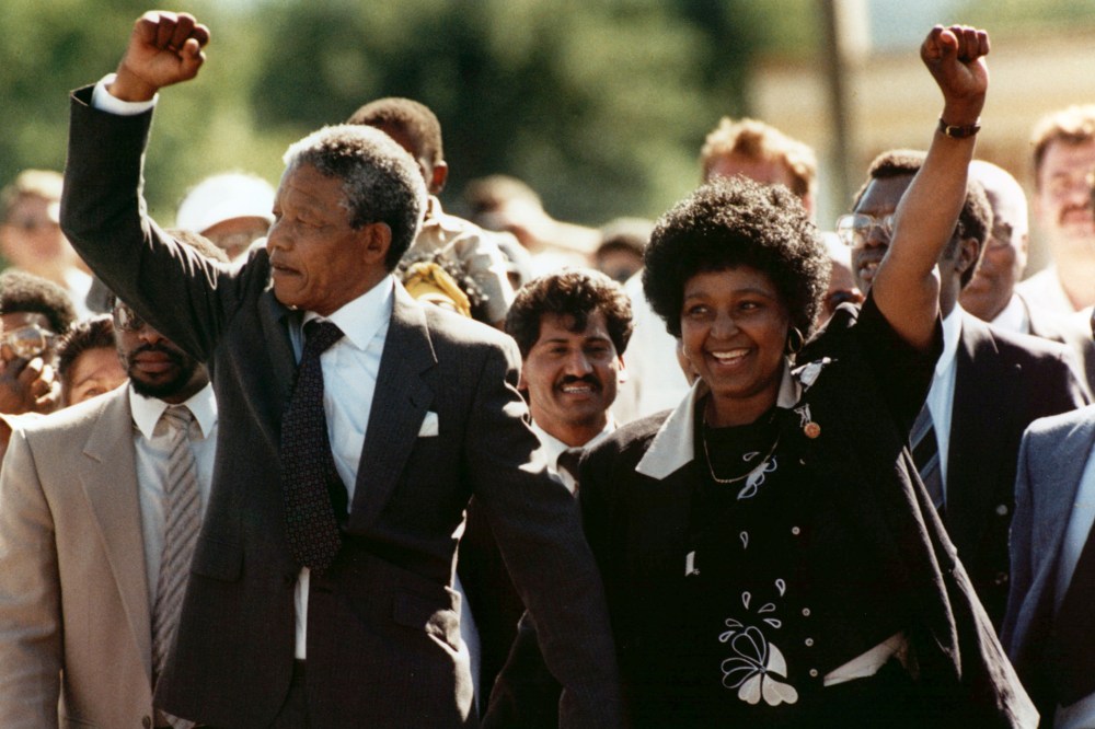 Nelson Mandela and wife Winnie, raise clenched fists upon his release from prison in Cape Town on Feb. 11, 1990. (Photo by Greg English/AP)