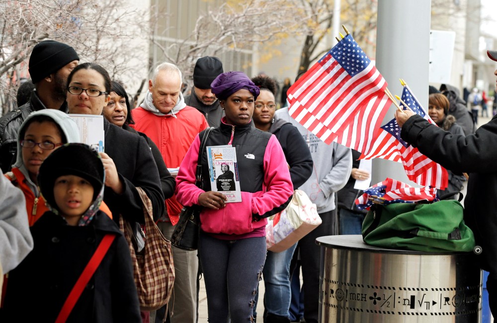 Voters wait in line outside the Cuyahoga County Board of Elections in Cleveland on the final day of early voting Monday, Nov. 5, 2012.