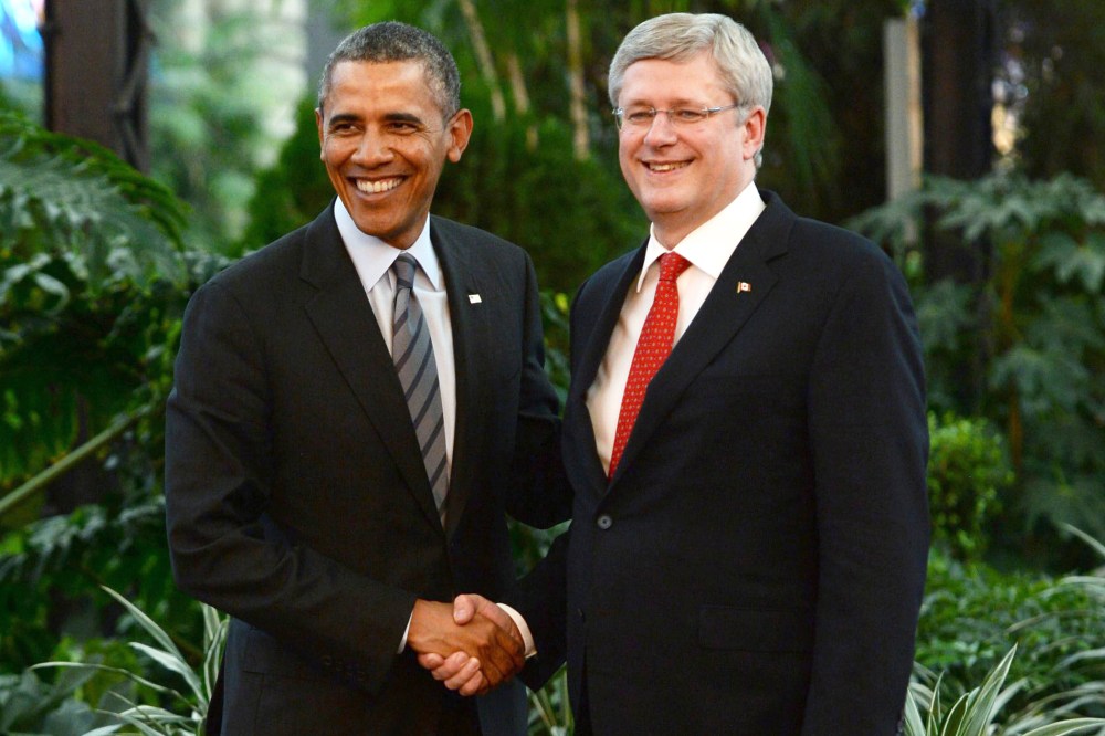 Canada's Prime Minister Stephen Harper shakes hands with President Barack Obama during the North American Leaders Summit in Toluca, Mexico,Feb. 19, 2014.