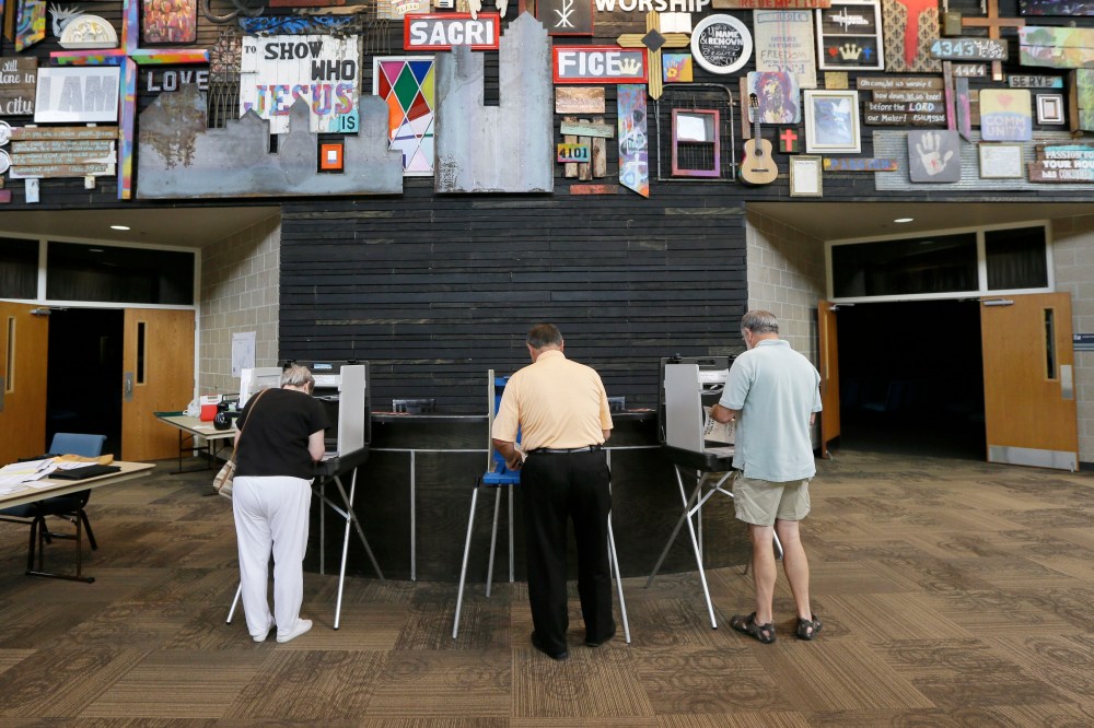 Voters fill out their ballots in Iowa's primary election, West Des Moines, Iowa, June 3, 2014.