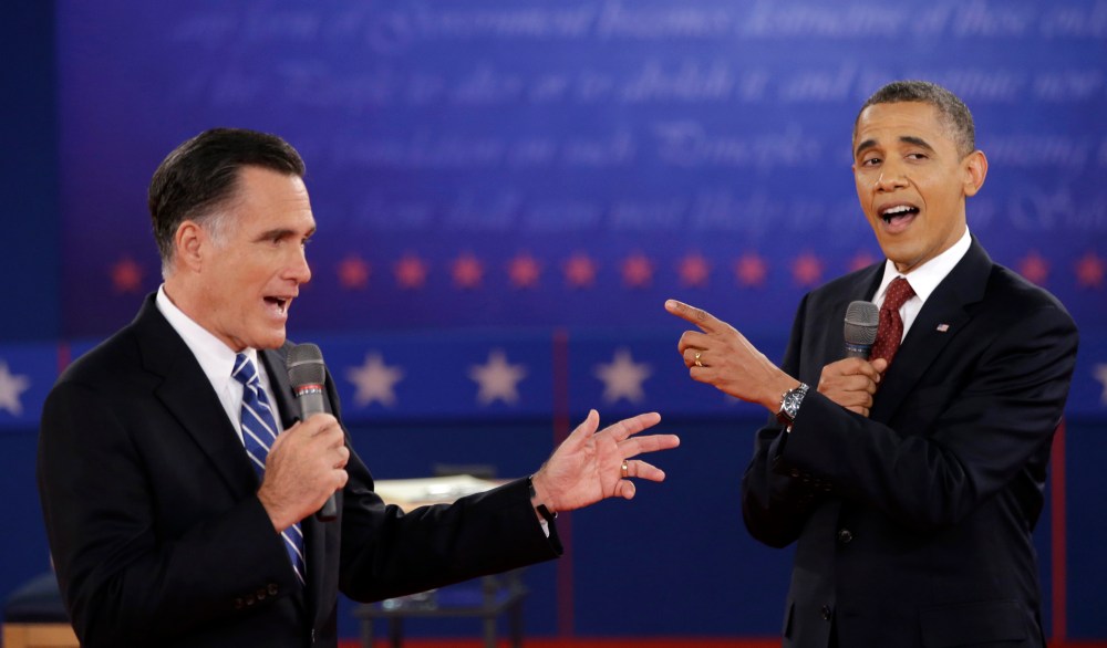 FILE - In this Oct. 16, 2012 file photo, President Barack Obama and Republican presidential candidate, former Massachusetts Gov. Mitt Romney exchange views during the second presidential debate at Hofstra University in Hempstead, N.Y. They interrupt...