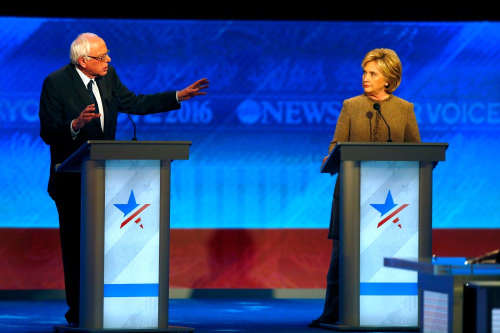 Bernie Sanders offers an apology to Hillary Clinton during a Democratic presidential primary debate, Dec. 19, 2015, at Saint Anselm College in Manchester, N.H. (Photo by Jim Cole/AP)