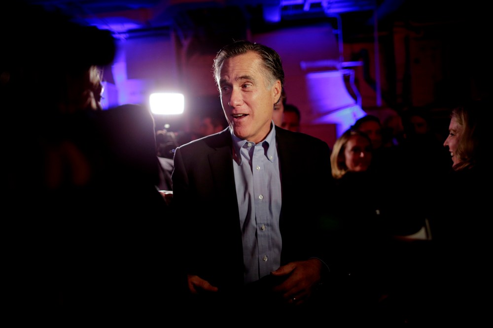 Mitt Romney, the former Republican presidential nominee, talks with people after speaking during the Republican National Committee's winter meeting aboard the USS Midway Museum, Jan. 16, 2015, in San Diego. (Photo by Gregory Bull/AP)