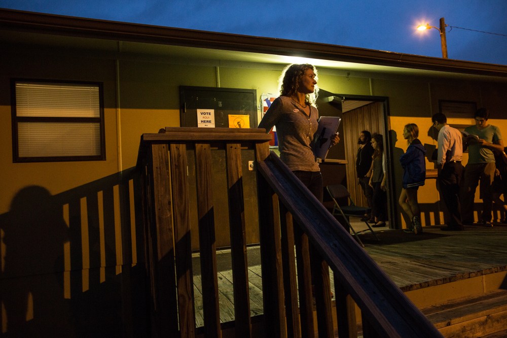Voters wait in line to cast their ballots in a portable structure outside of David Chapel Baptist Church on Tuesday, Nov. 4, 2014 in Austin, Texas. (Photo by Tamir Kalifa/AP)