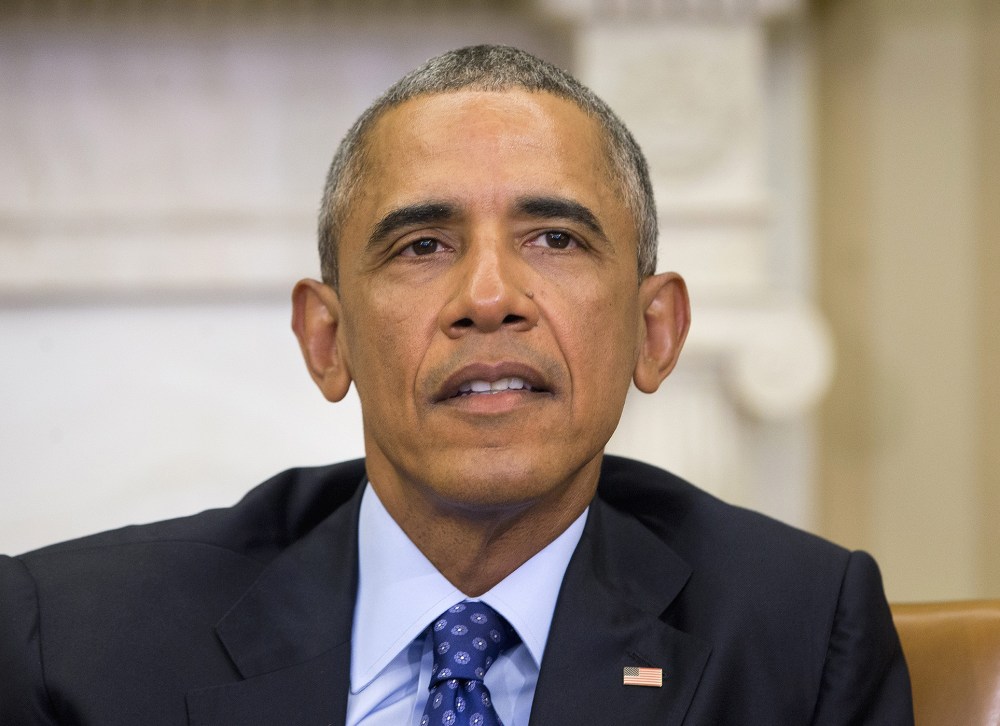 President Obama speaks in the Oval Office of the White House, Jan. 4, 2016, during a meeting with law enforcement officials to discuss executive actions the president can take to curb gun violence. (Photo by Pablo Martinez Monsivais/AP)