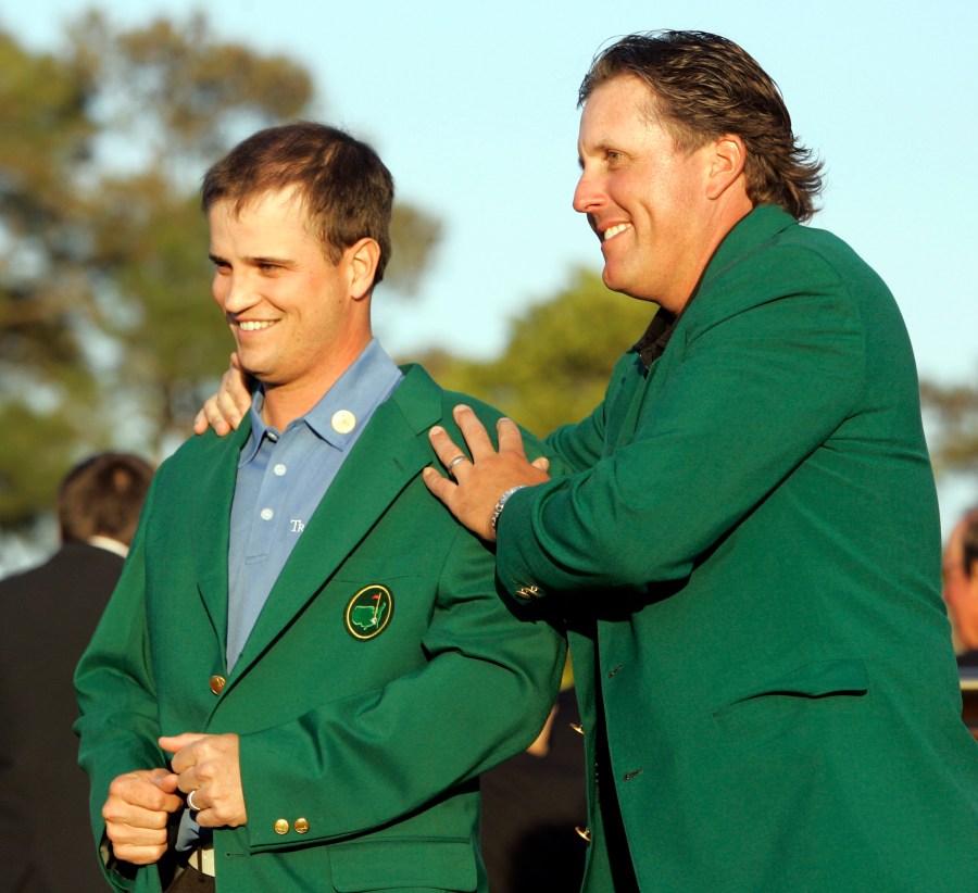 Zach Johnson, left, receives the Masters green jacket from last year's champion Phil Mickelson after winning the 2007 Masters golf tournament at the Augusta National Golf Club in Augusta, Ga. on April 8, 2007. (Photo by Morry Gash/AP)