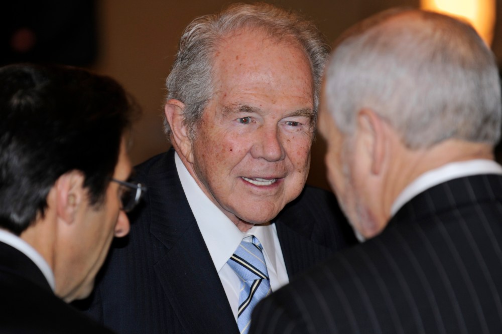 Rev. Pat Robertson, center, talks to attendees at a prayer breakfast at the Capitol in Richmond, Va. on Jan. 16, 2010. (Photo by Clem Britt/AP)