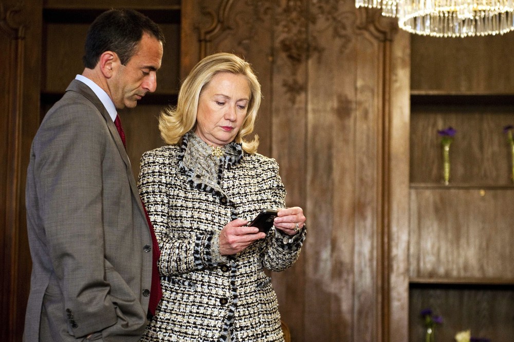 US Secretary of State Hillary Clinton looks at her phone during the 48th Munich Security Conference at the Bayerischer Hof hotel in Munich, Germany, Feb. 4, 2012. (Photo by Jim Watson/Pool/AP)