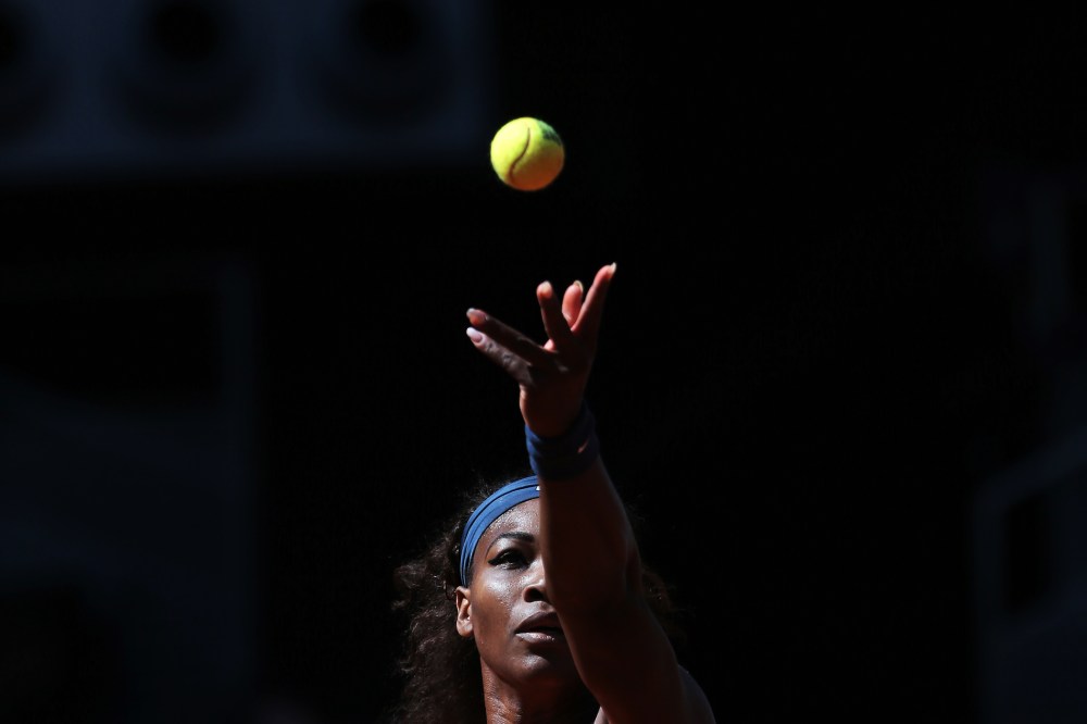 Serena Williams from U.S. serves during a match at the Madrid Open tennis tournament, in Madrid, May 11, 2013. (Photo by Andres Kudacki/AP)