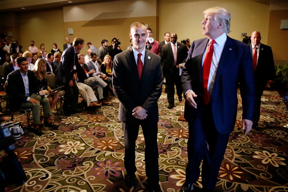 In this Aug. 25, 2015 file photo, Republican presidential candidate Donald Trump, right, walks with his campaign manager Corey Lewandowski after speaking at a news conference in Dubuque, Iowa. (Photo by Charlie Neibergall/AP)