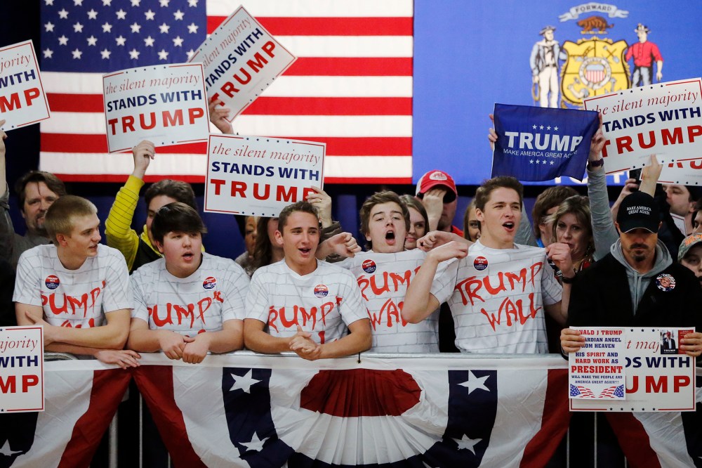 Supporters of Republican presidential candidate, Donald Trump, chant, "Build That Wall," before a town hall, April 2, 2016, in Rothschild, Wis. (Photo by Charles Rex Arbogast/AP)