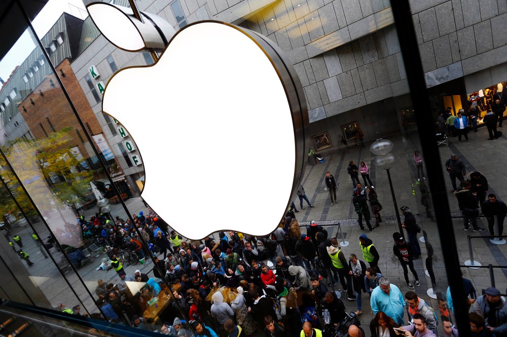 In this Friday, Sept. 25, 2015, file photo, people wait in front of the Apple store in Munich, before the worldwide launch of the iPhone 6s. (Photo by Matthias Schrader/AP)