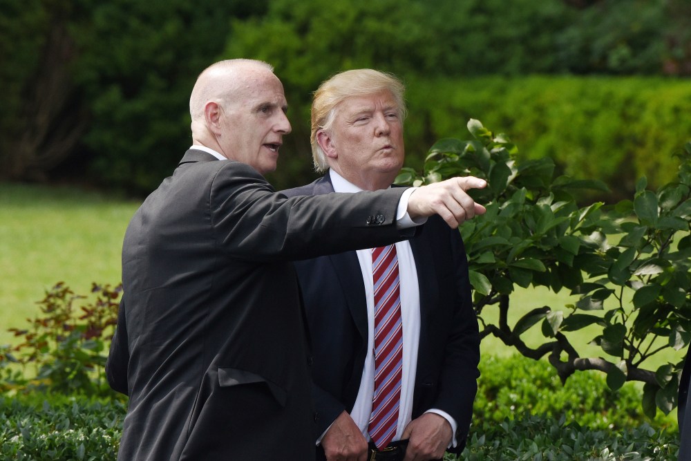 Keith Schiller, deputy assistant to the president and director of Oval Office operations talks to President Donald Trump during a ceremony to welcome the 2016 NCAA Football National Champions The Clemson Tigers on the South Lawn of the White House on June