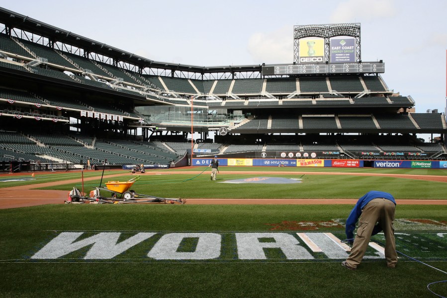 Grounds crew prepare Citi Field for the Major League Baseball World Series between the New York Mets and the Kansas City Royals, Oct. 27, 2015, in New York. (Photo by Mary Altaffer/AP)