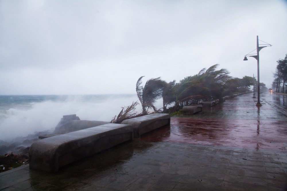 Strong winds and waves batter the coast as tropical storm Erika approaches Santo Domingo, Dominican Republic, Aug. 28, 2015. (Photo by Tatiana Fernandez/AP)
