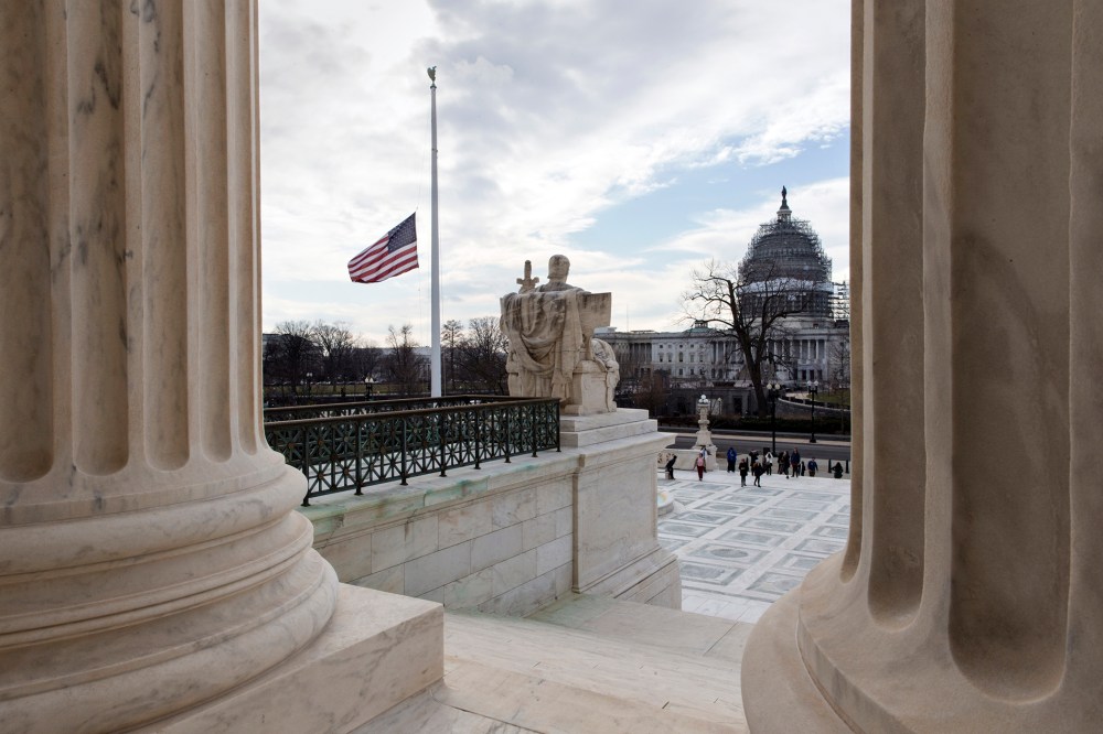 The U.S. flag flies at half-staff at the Supreme Court, Feb. 17, 2016, in honor of Supreme Court Justice Antonin Scalia, who died last weekend at age 79. (Photo by J. Scott Applewhite/AP)