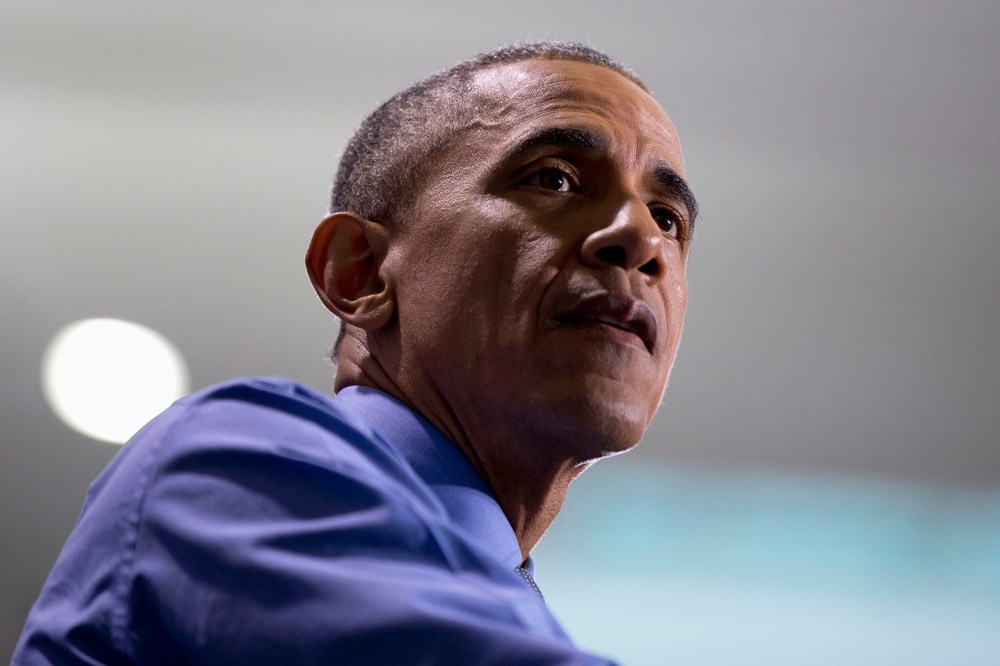 President Barack Obama pauses as he speaks at the UAW-GM Center for Human Resources in Detroit, Jan. 20, 2016. (Photo by Carolyn Kaster/AP)