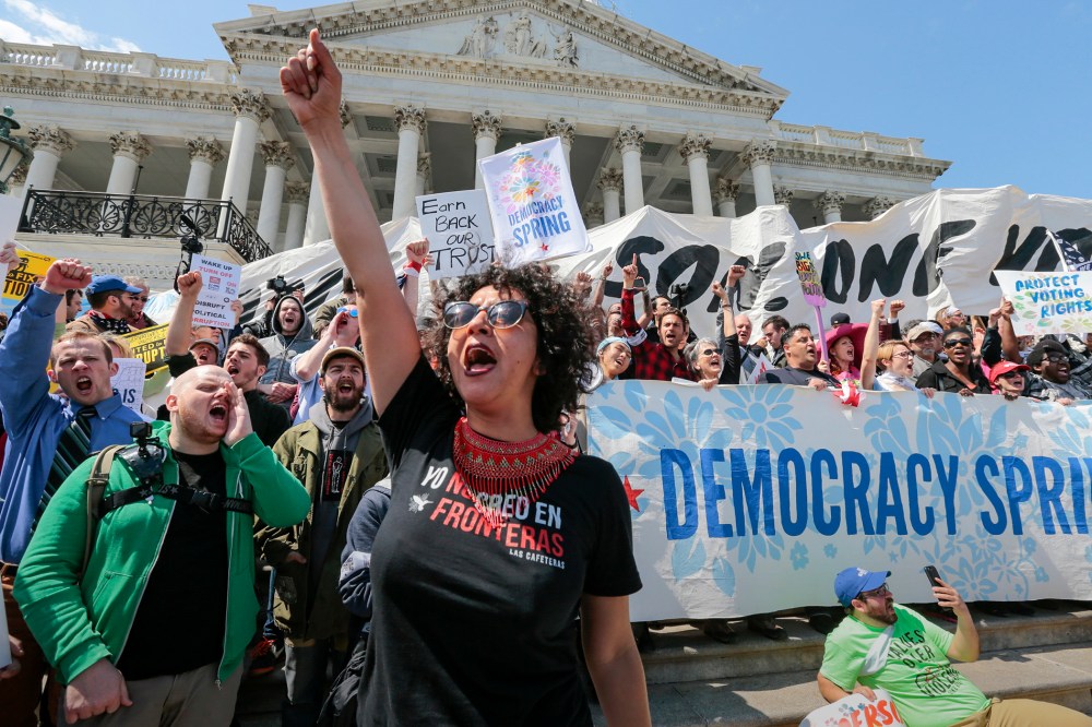 Alejandra Pablos of Arizona leads a chant as voting rights reform demonstrators stage a sit-in at the Capitol in Washington, April 11, 2016, urging lawmakers to take money out of the political process. (Photo by J. Scott Applewhite/AP)
