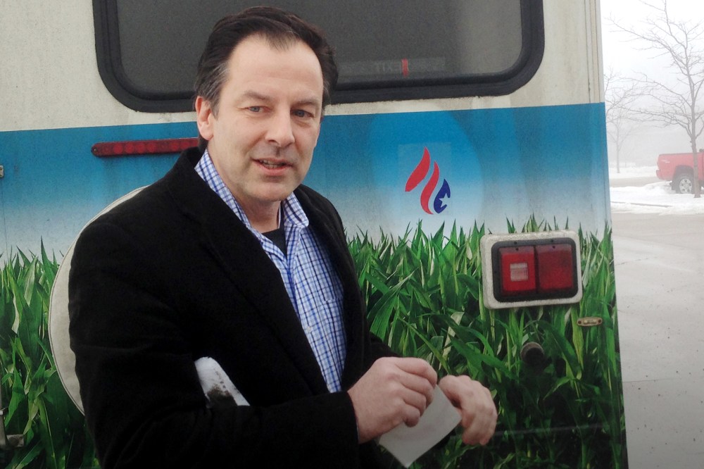 Rick Tyler, communications director for Sen. Ted Cruz, R-Texas presidential campaign, speaks speaks after affixing a Cruz sticker on an RV of a group that is openly critical of Cruz, Jan. 7, 2015, in Storm Lake, Iowa. (Photo by Scott Bauer/AP)