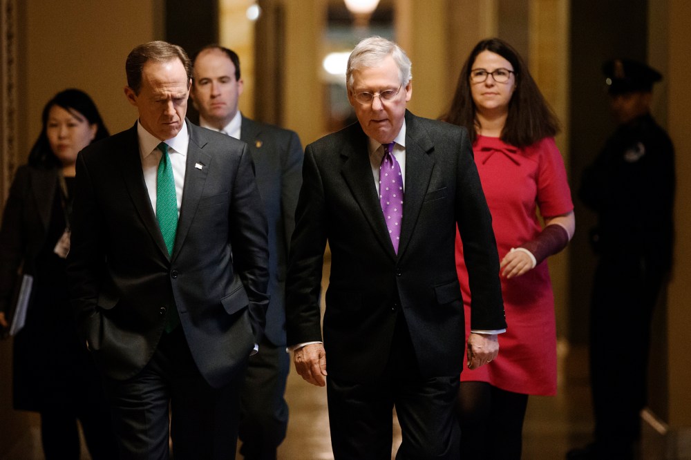 Senate Majority Leader Mitch McConnell, R-Ky., walks with Sen. Pat Toomey, R-Pa. to the chamber to vote at the Capitol in Washington, Feb. 10, 2016. (Photo by J. Scott Applewhite/AP)