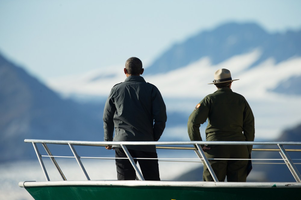 President Barack Obama and a National Park Service employee look at Bear Glacier, which has receded 1.8 miles in approximately 100 years, Tuesday, Sept. 1, 2015, in Seward, Alaska. (Photo by Andrew Harnik/AP)