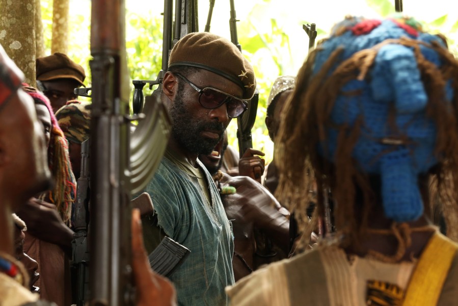 This photo provided by Netflix shows Idris Elba as Commandant in a scene from the new film, 