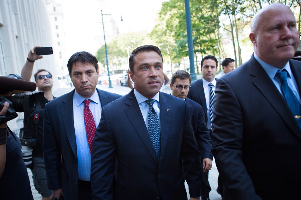 Former U.S. Rep. Michael Grimm (C) arrives ahead of his sentencing at federal court in Brooklyn, N.Y. (Photo by Kevin Hagen/AP).