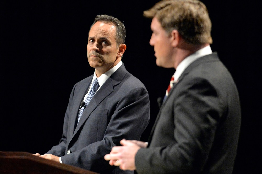 Kentucky Republican gubernatorial candidate Matt Bevin, left, looks on as Democratic candidate Jack Conway responds to a question during the League of Women Voters debate, Oct. 25, 2015, in Richmond, Ky. (Photo by Timothy D. Easley/AP)