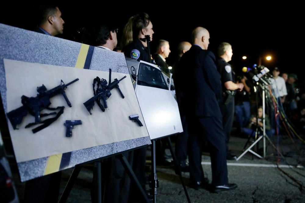 Police crime photos are displayed during a press conference near the site of yesterday's mass shooting on Dec. 3, 2015 in San Bernardino, Calif. (Photo by Chris Carlson/AP)