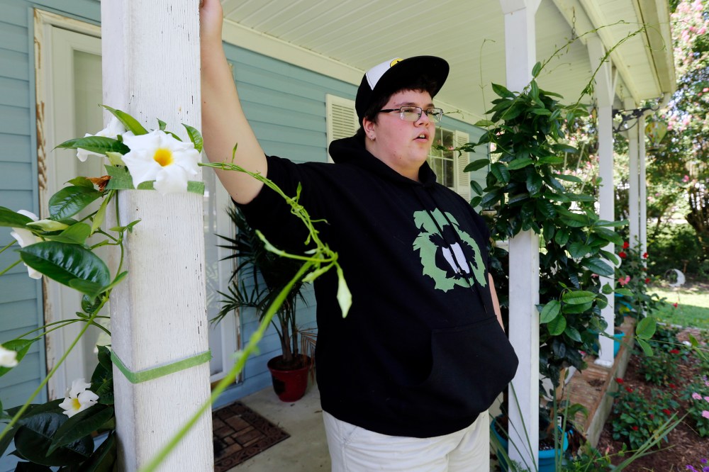 This Tuesday Aug. 25, 2015 photo shows Gavin Grimm leans on a post on his front porch during an interview at his home in Gloucester, Va. (Photo by Steve Helber/AP)