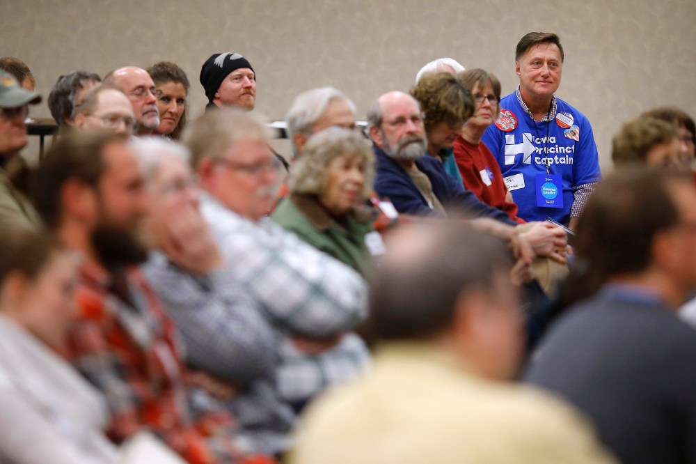 John Grause, top right, precinct captain for Democratic presidential candidate Hillary Clinton, sits with voters during a Democratic party caucus in Nevada, Iowa, Feb. 1, 2016. (Photo by Patrick Semansky/AP)