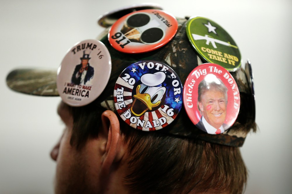 A supporter for Republican presidential candidate Donald Trump listens during a campaign rally, Dec. 5, 2015, in Davenport, Iowa. (Photo by Charlie Neibergall/AP)
